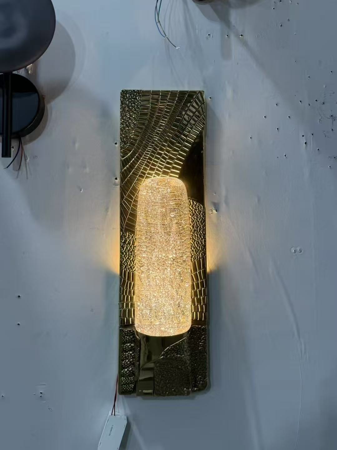Textured gold wall light during workshop testing