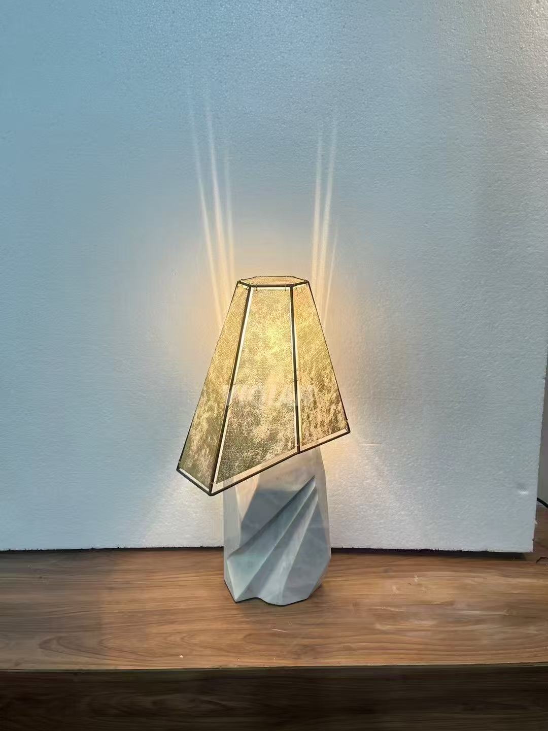 Marble and textured-glass table lamp during testing