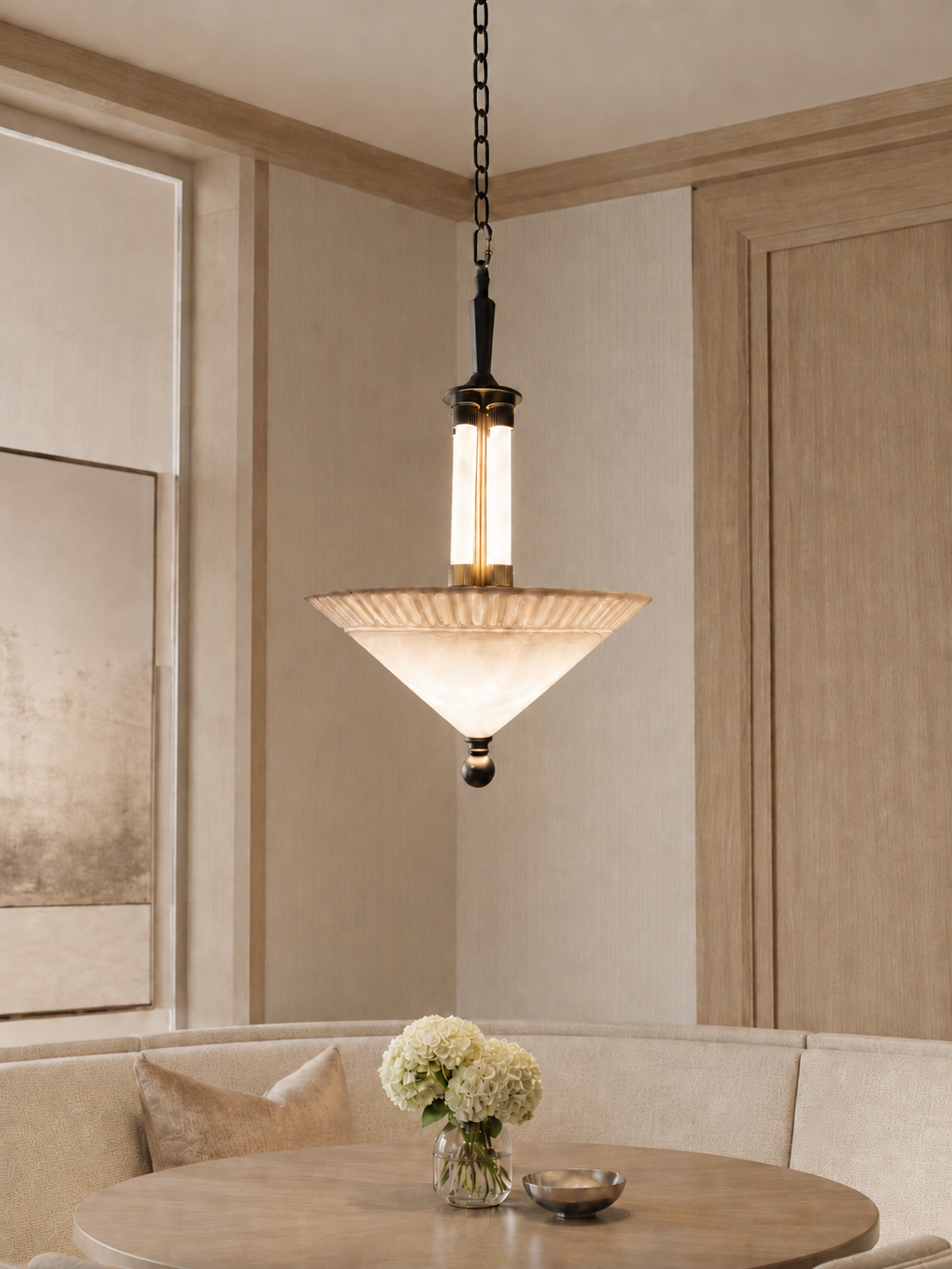 Interior visualisation featuring an illuminated bowl form beneath a dark vertical structure