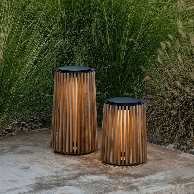 Two custom timber outdoor lanterns with vertical slats on a luxury resort terrace.