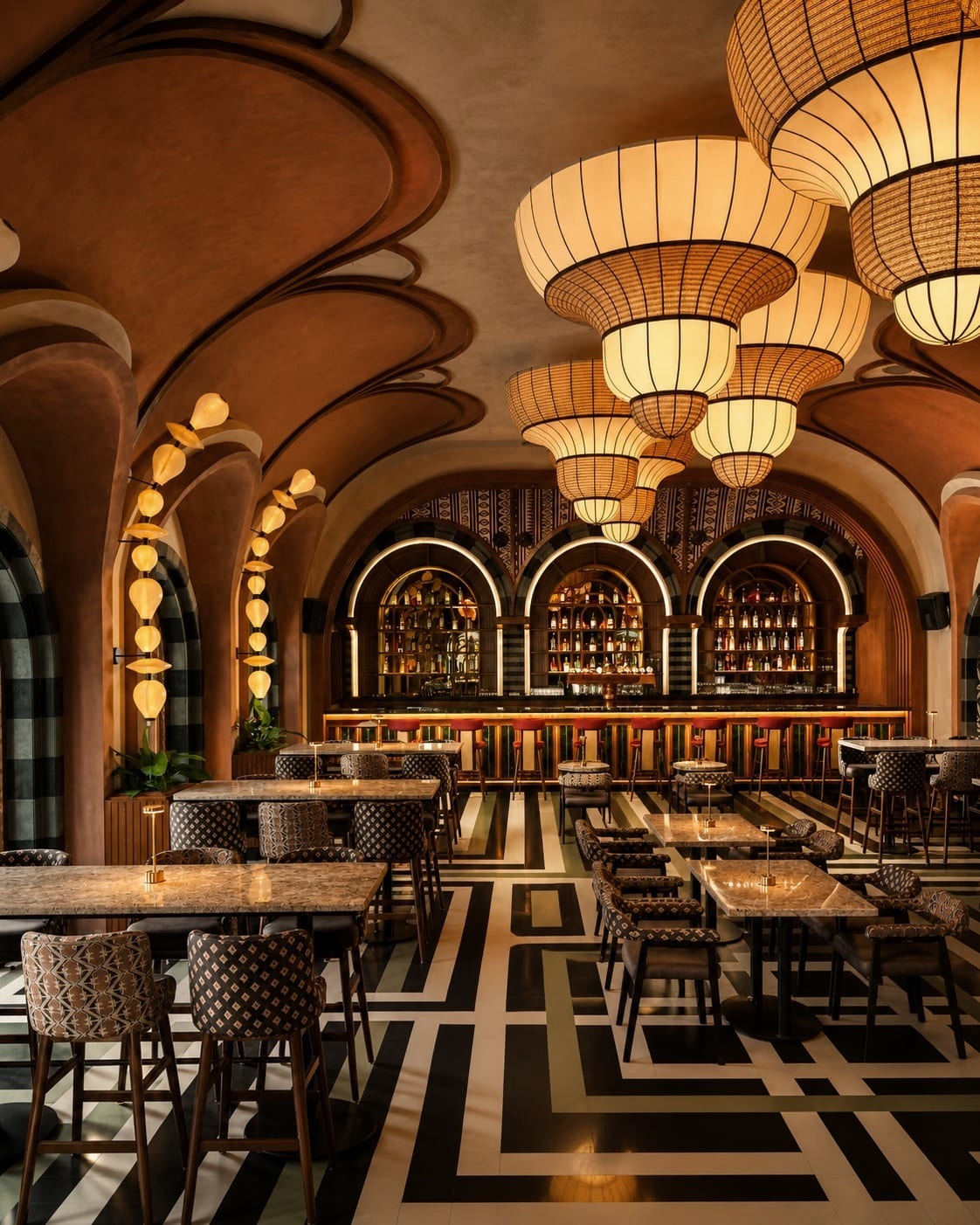 Hospitality restaurant interior with decorative pendant lighting and integrated architectural illumination