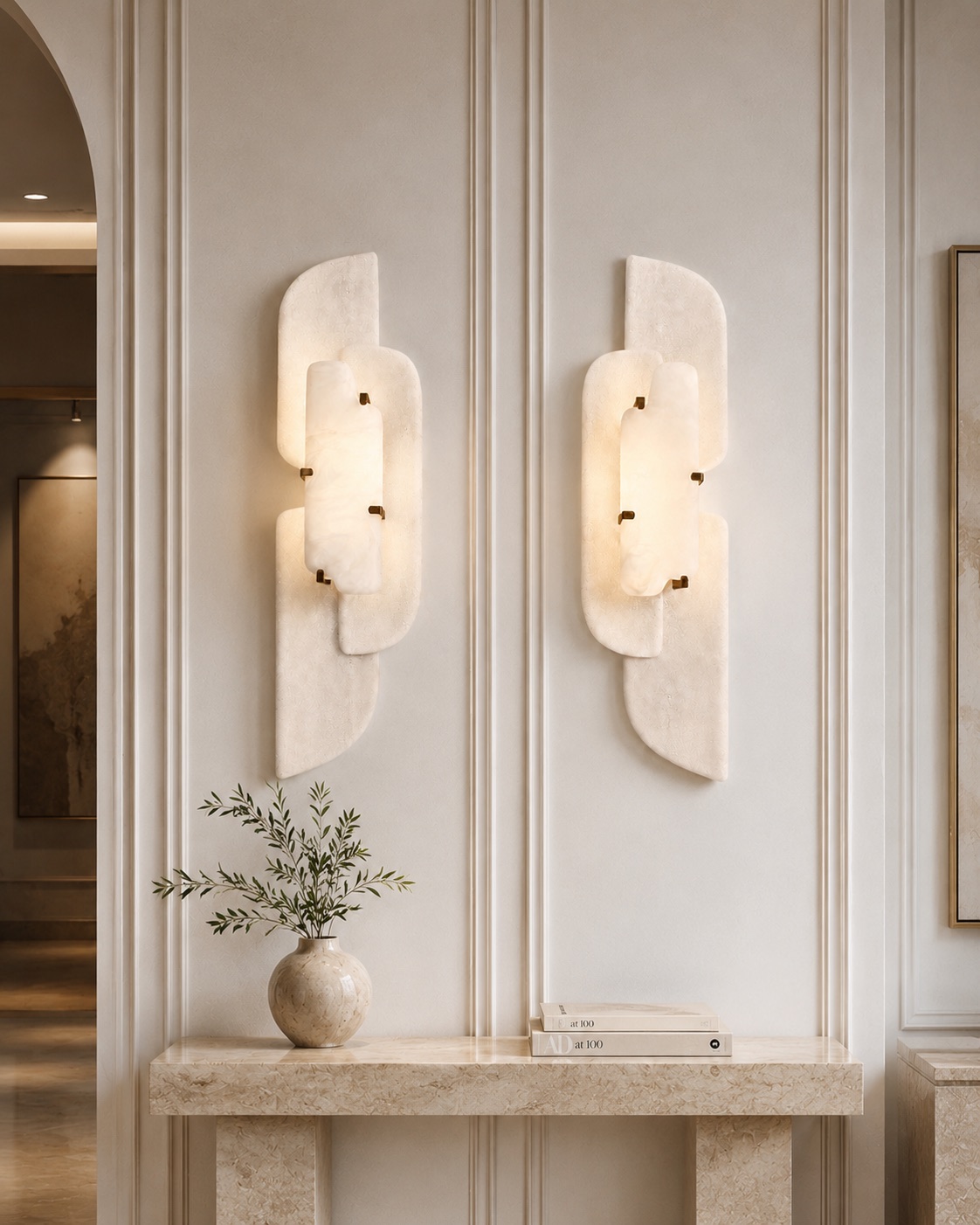 Pair of custom layered translucent wall lights with small brass fixings in a refined luxury interior